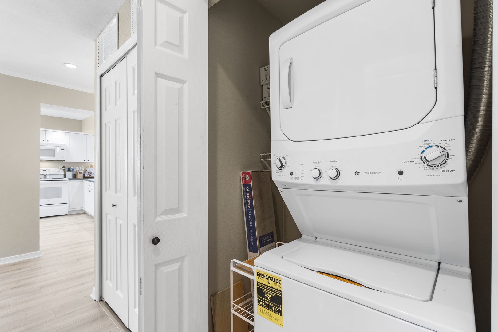 Private laundry is neatly tucked away in a hall closet