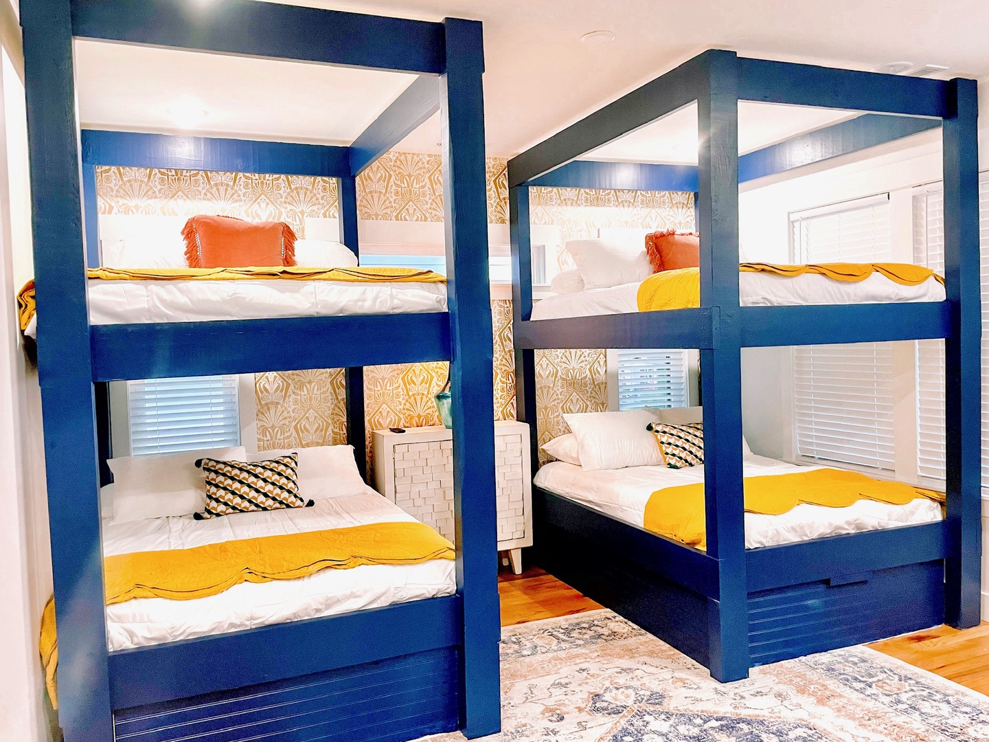 2 full-over-full bunkbeds, a twin daybed, & private ensuite await in Bedroom 1