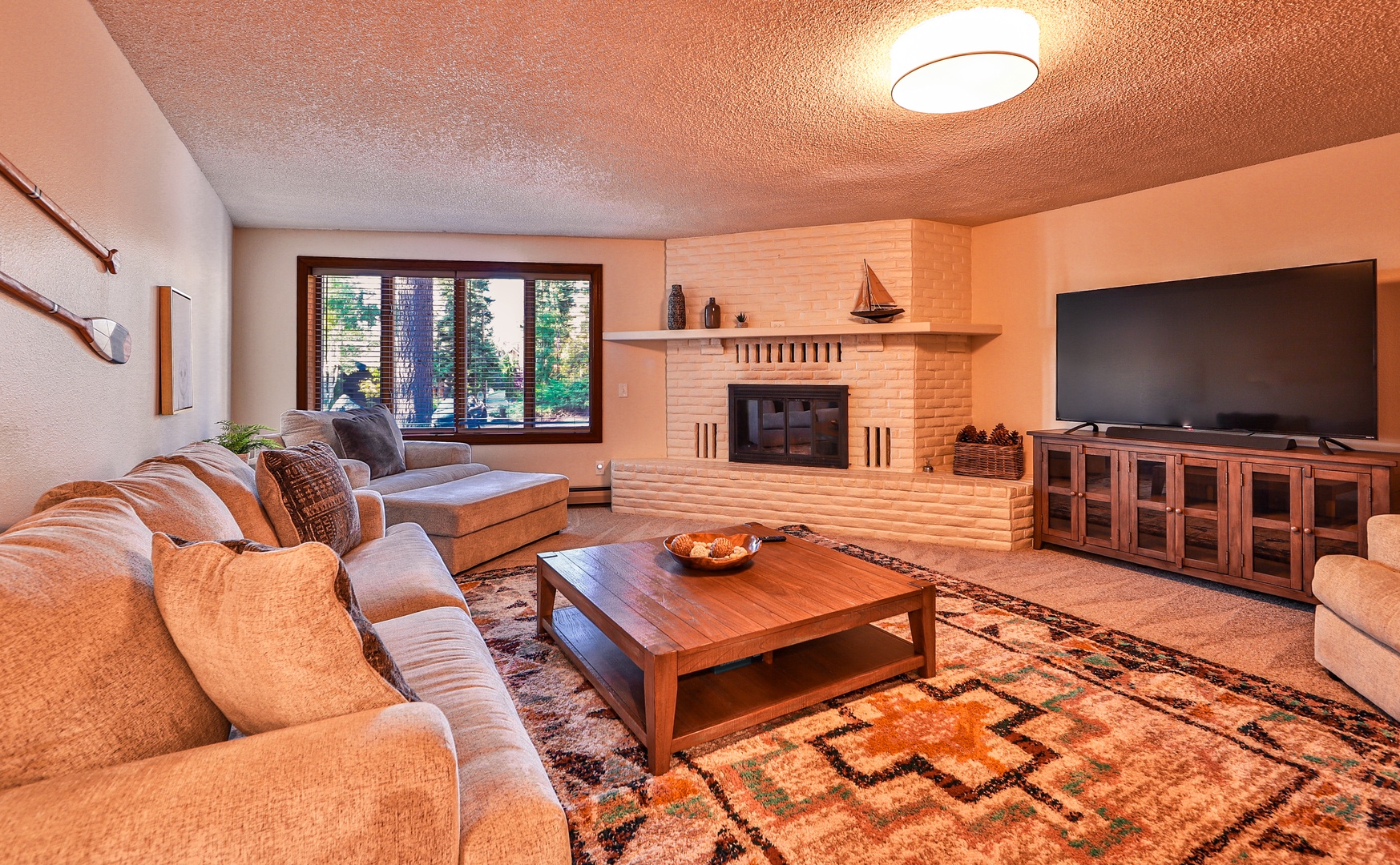 Downstairs living area with wet bar, Smart TV, and queen sofa sleeper