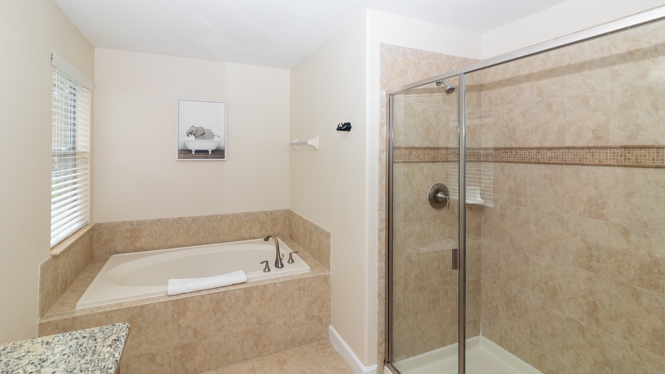 En-suite bathroom to bedroom 2 with stand-in shower and soaking tub (1st floor)