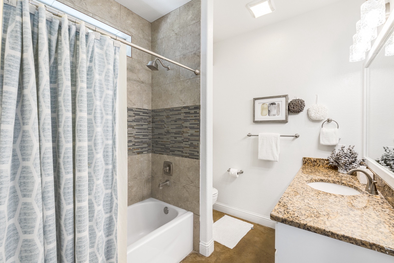 The 1st Floor Queen En Suite boasts a spacious Single Vanity and Shower/Tub Combo