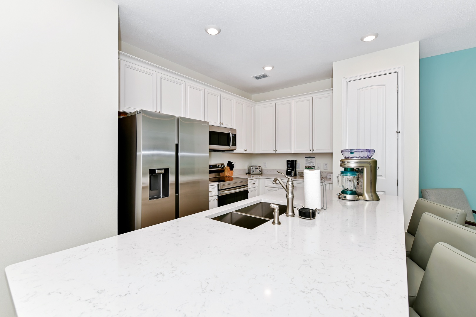 The kitchen offers ample storage space & all the comforts of home