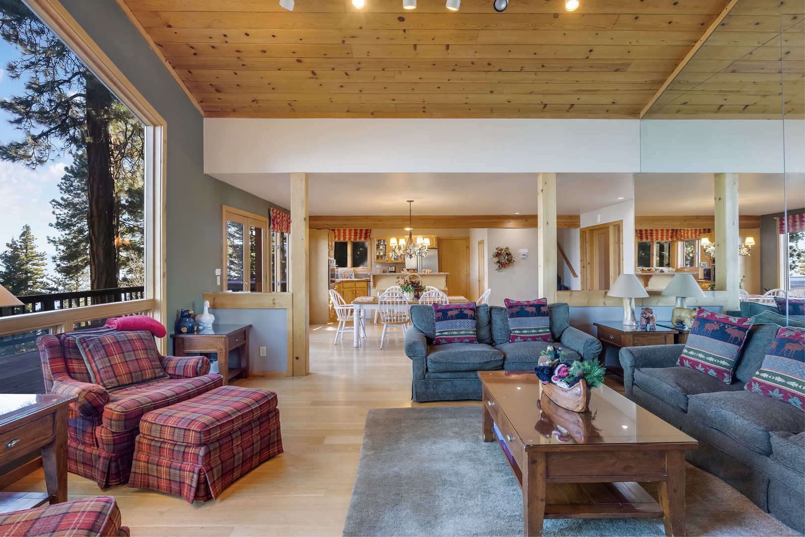 Cozy living room with a fireplace and stunning lake views through large windows