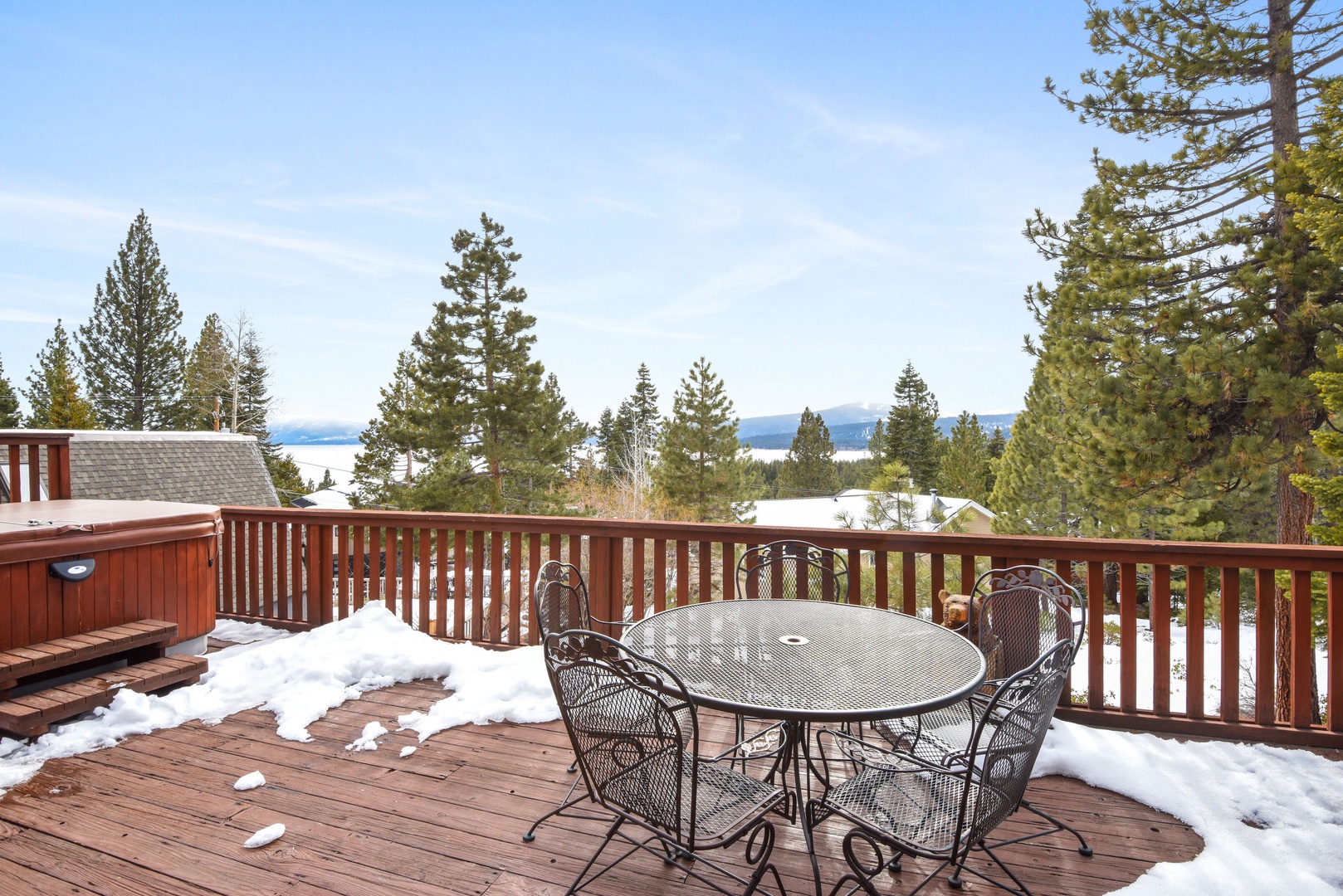 Balcony with private hot tub, outdoor seating, gas BBQ and lake/mountain views