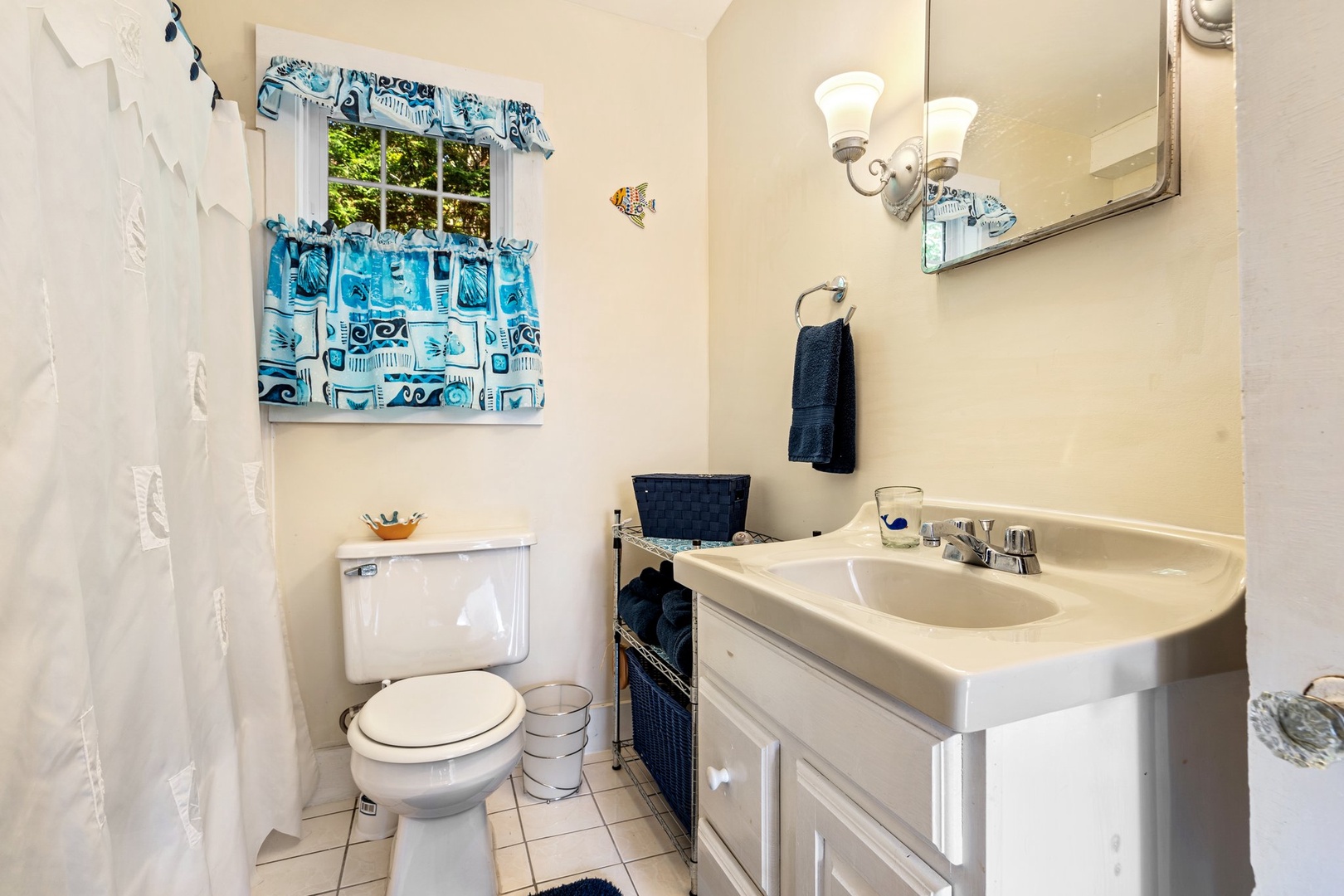 Shared bathroom with shower/tub combo and laundry area