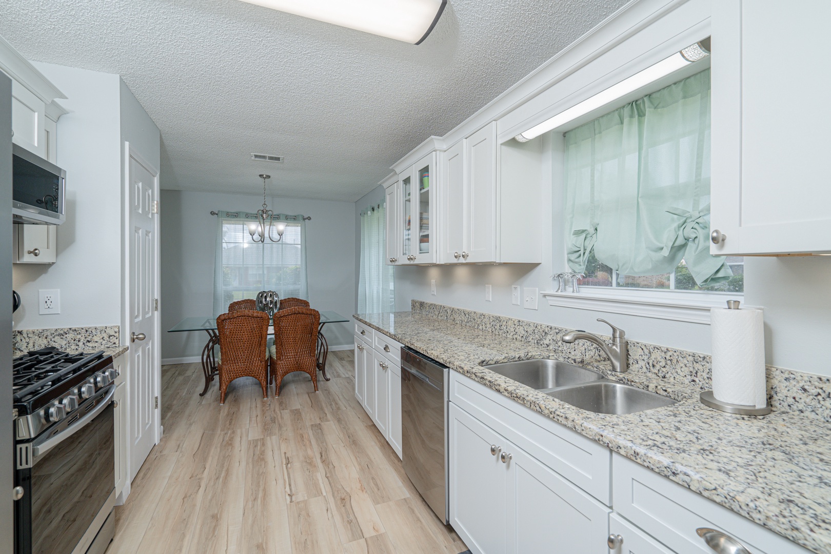 The breezy kitchen offers ample space & all the comforts of home