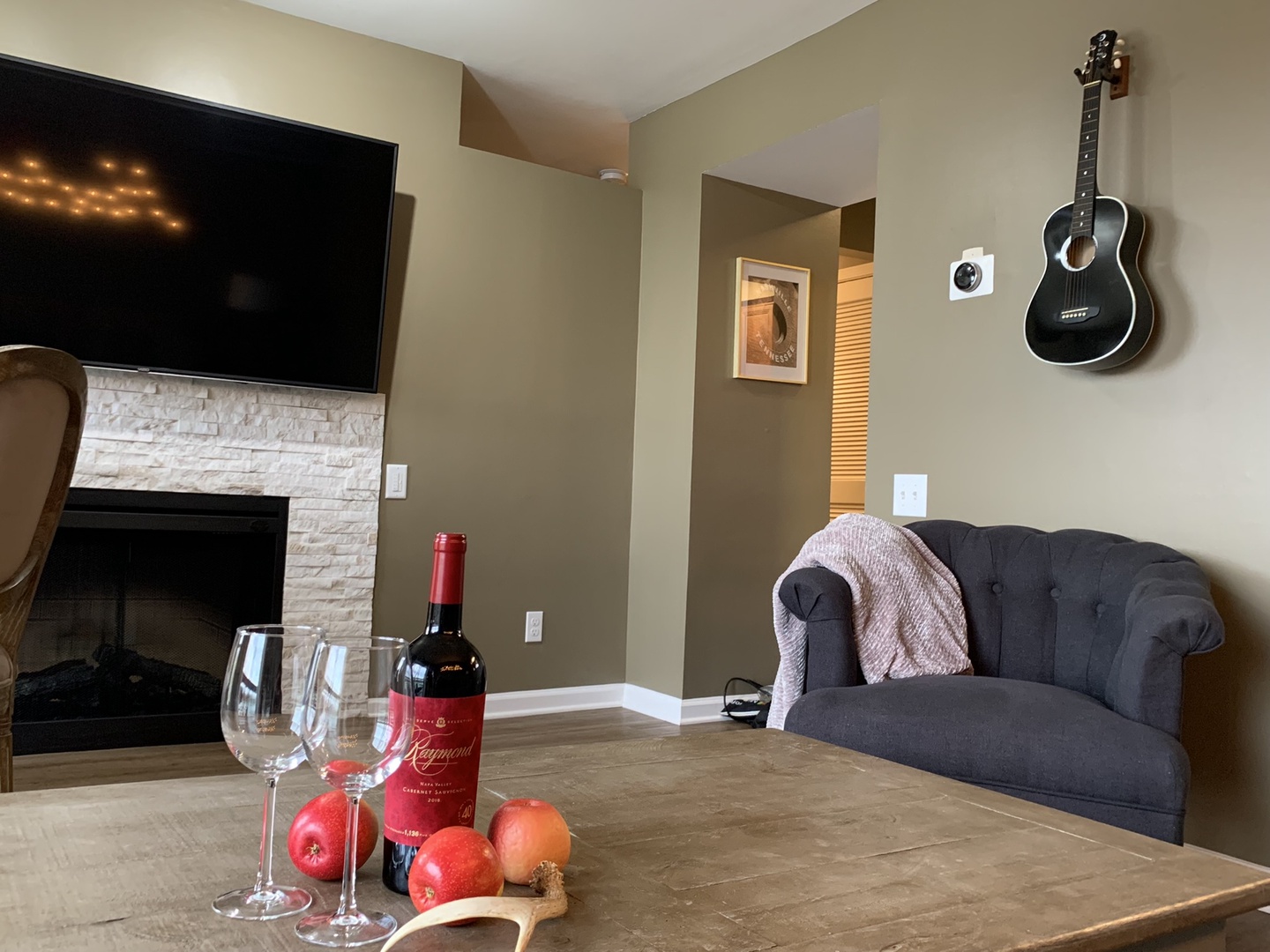 Living room with sofa sleeper, Smart TV, and balcony