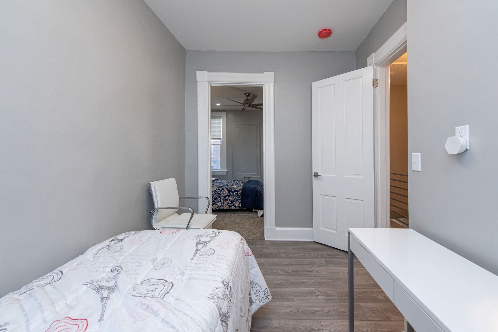 Suite 2 – The final bedroom includes a twin bed, chair, & desk/workspace
