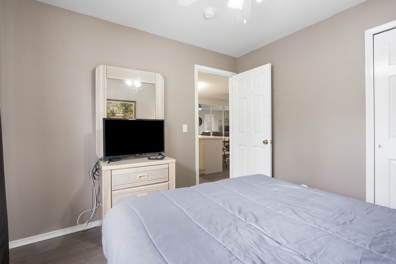Bedroom #2 with Queen Bed, TV, and en-suite