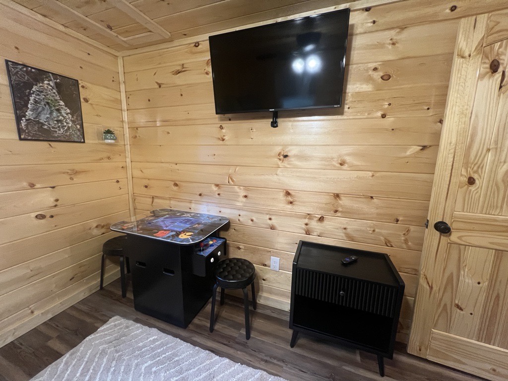 The third bedroom retreat contains a full over full bunk, TV & arcade area