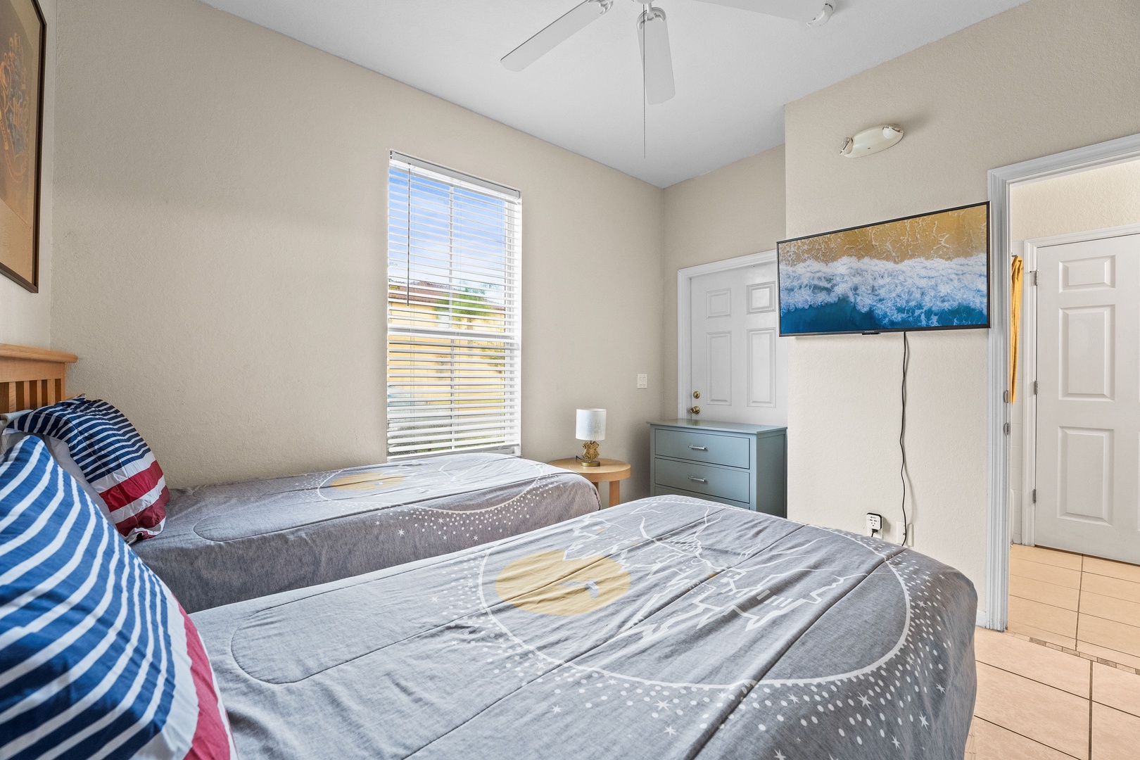 Double twin bedroom with ceiling fan and Harry Potter-themed