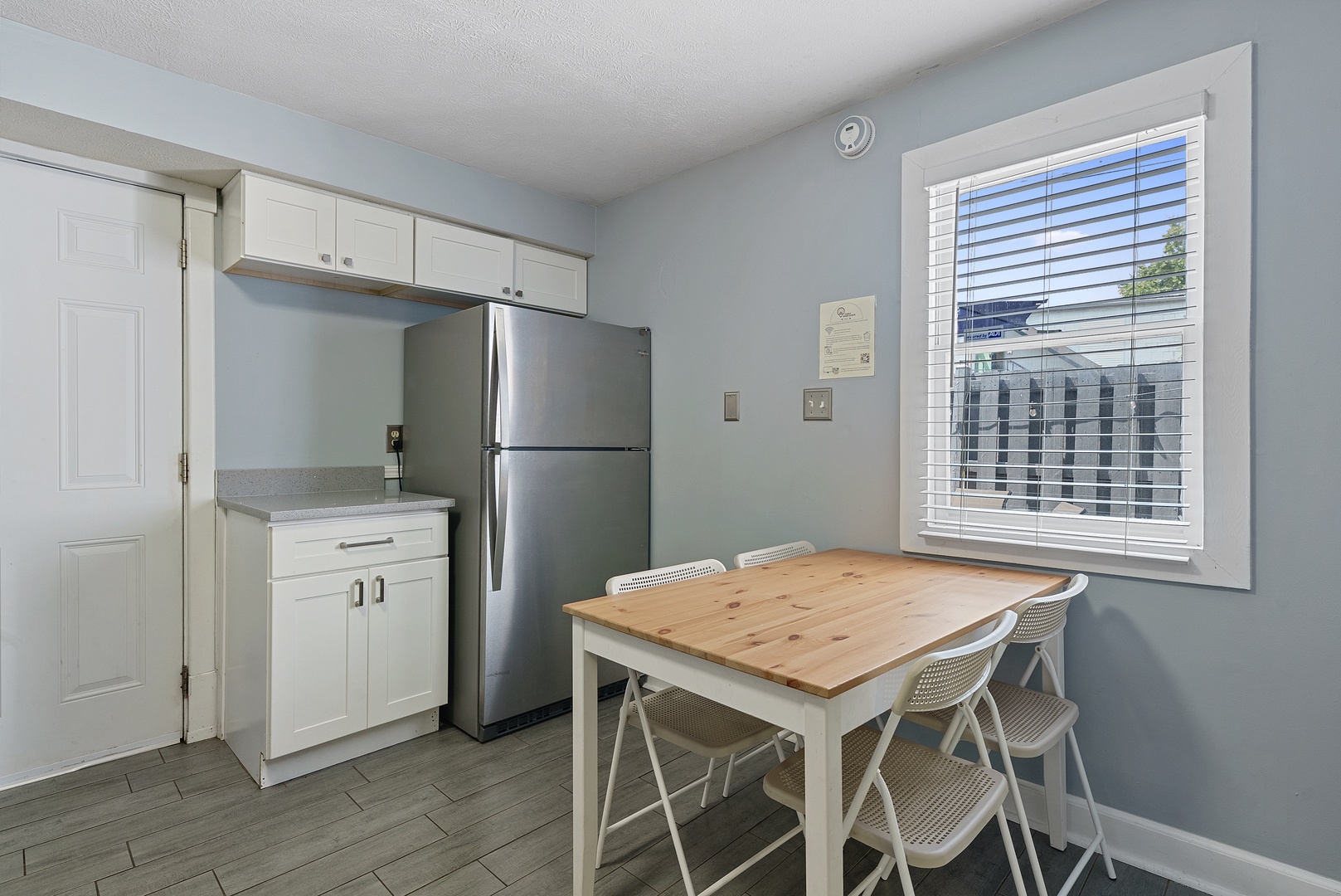 The airy eat-in kitchen offers ample space & all the comforts of home