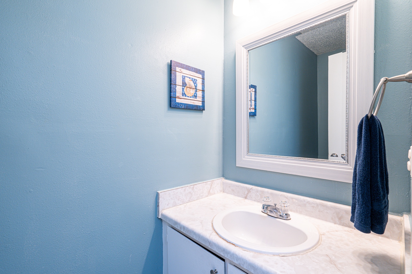 A convenient half bath is available just off the entryway