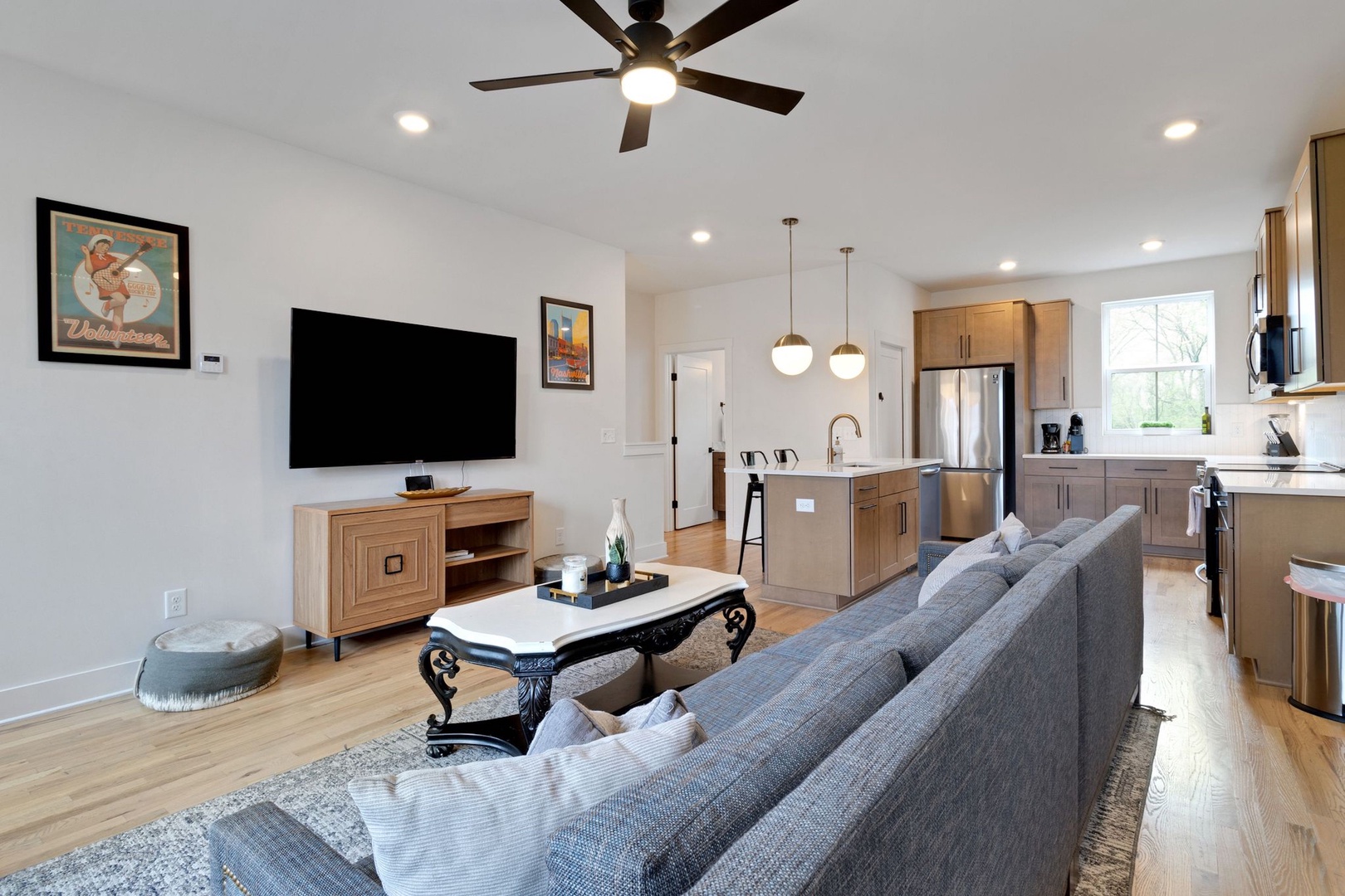 Living room with ample seating, full size futon, and Smart TV