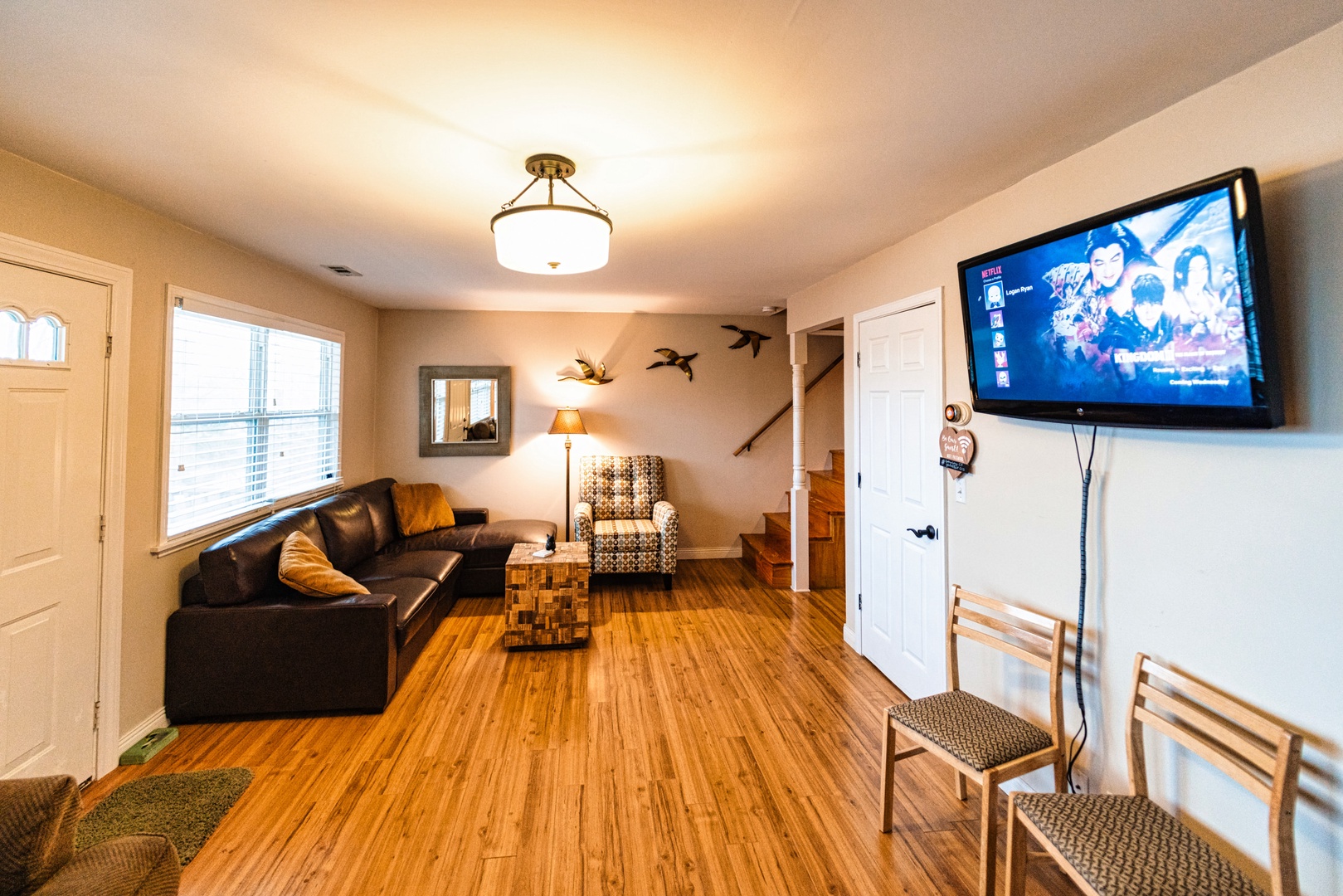 Indulge in your favorite movies and shows within the living space, complete with a sofa sleeper and a futon