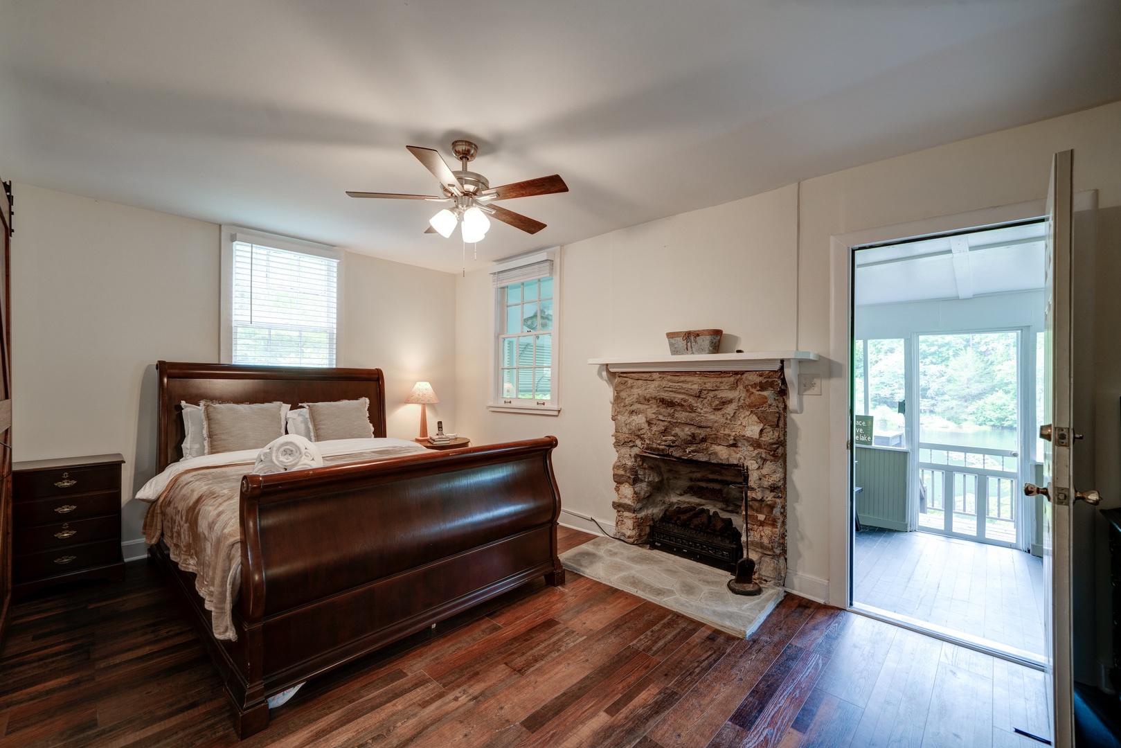 The master suite boasts a queen bed, ensuite bath with laundry, & porch access