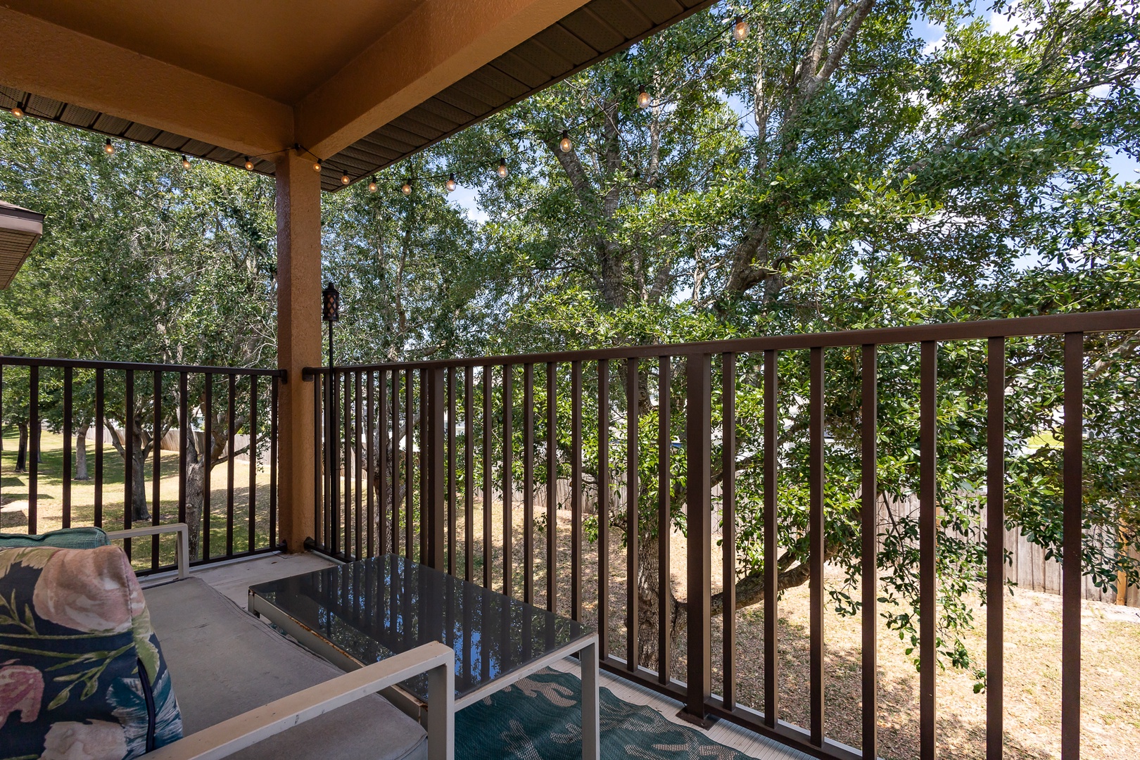 Step out onto the upper-level balcony & unwind in the shade