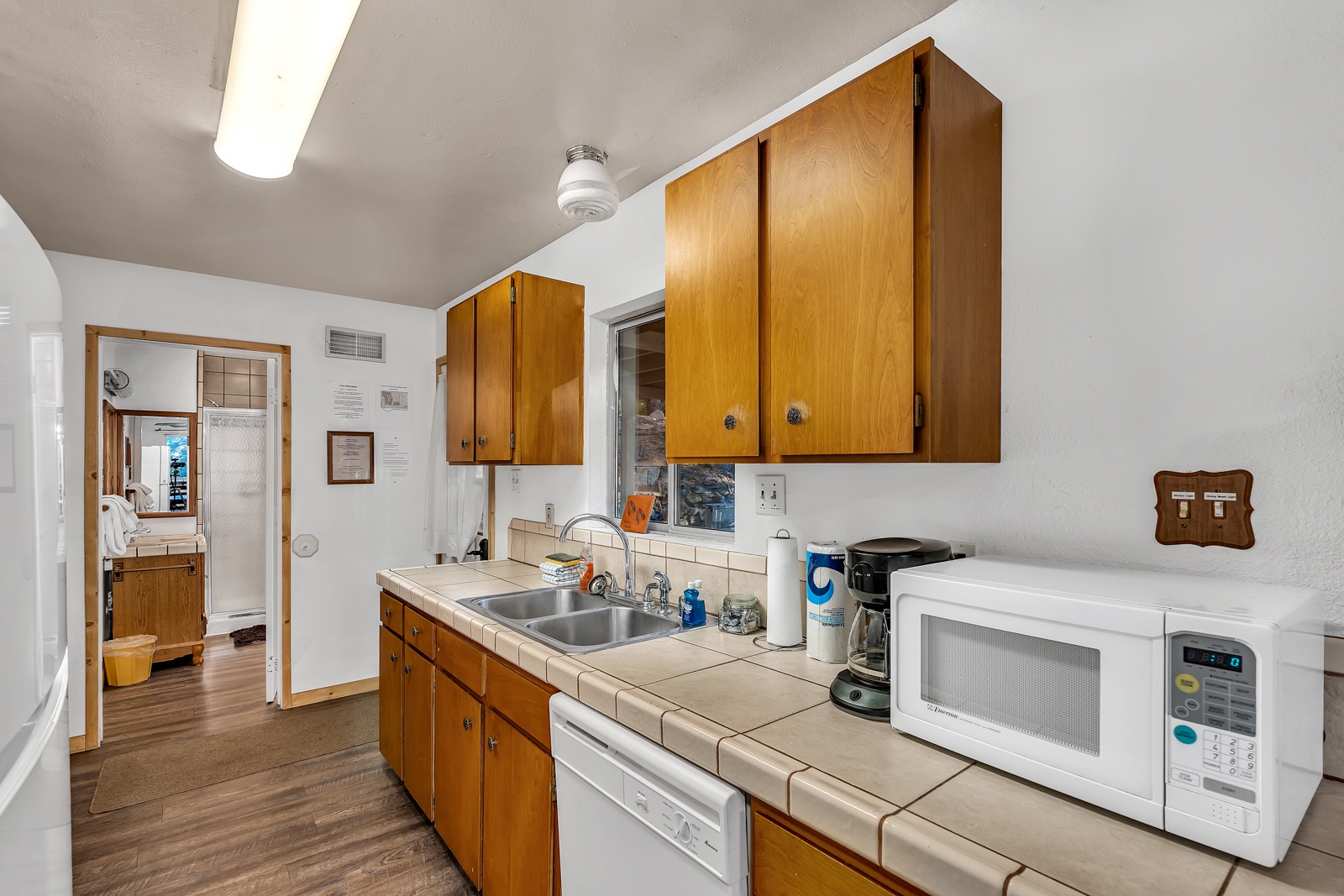 The kitchen offers ample storage space & all the comforts of home