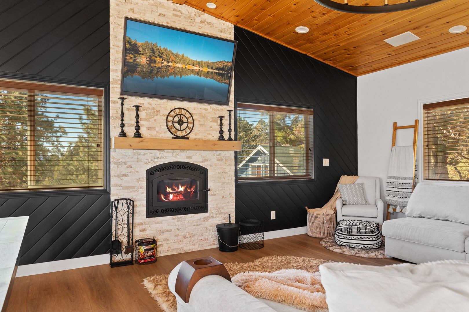 Living room features wood burning fireplace and SmartTV