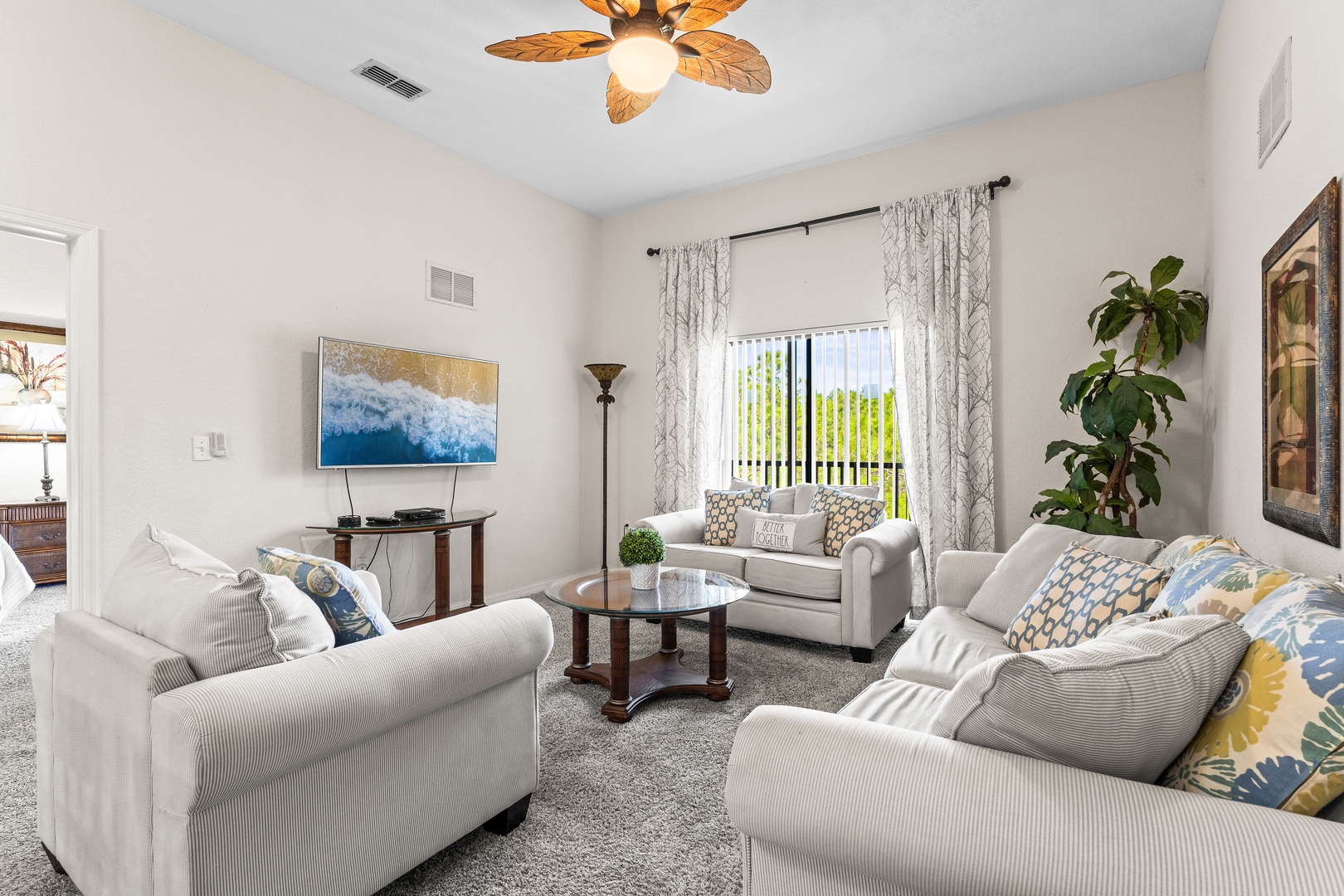 5Cozy living room featuring a smart TV and a full-size sleeper sofa