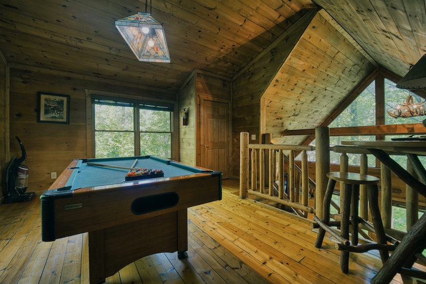 Get competitive in the loft, offering a pool table, Smart TV, & sleeping nook