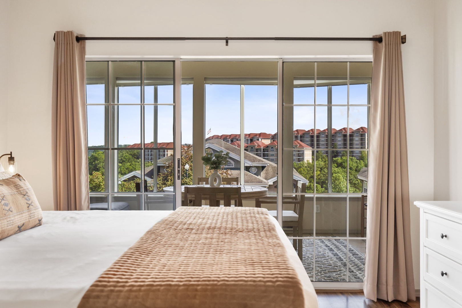 The king suite boasts patio access, a spacious en suite, & TV