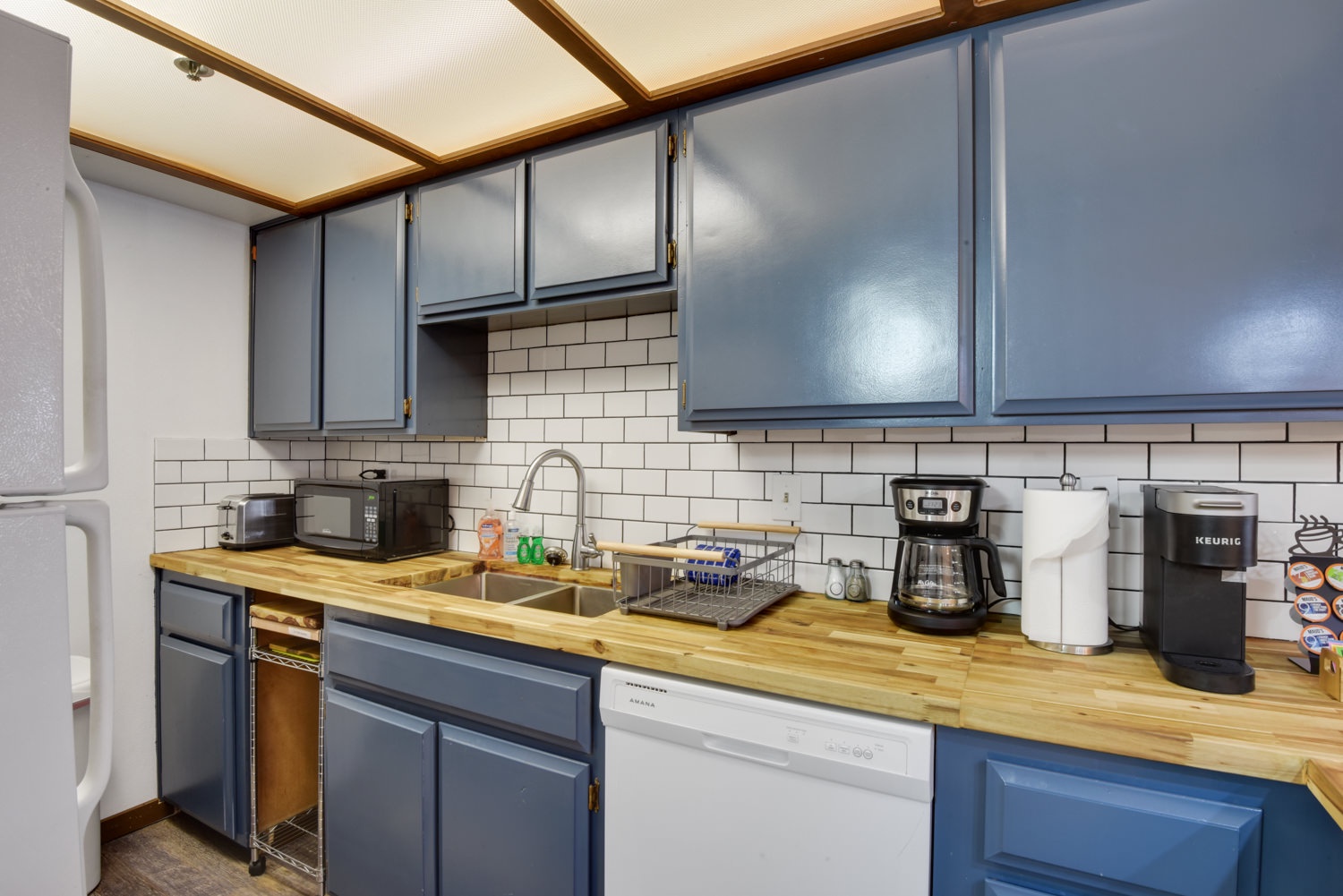 Kitchen features coffee pot and toaster
