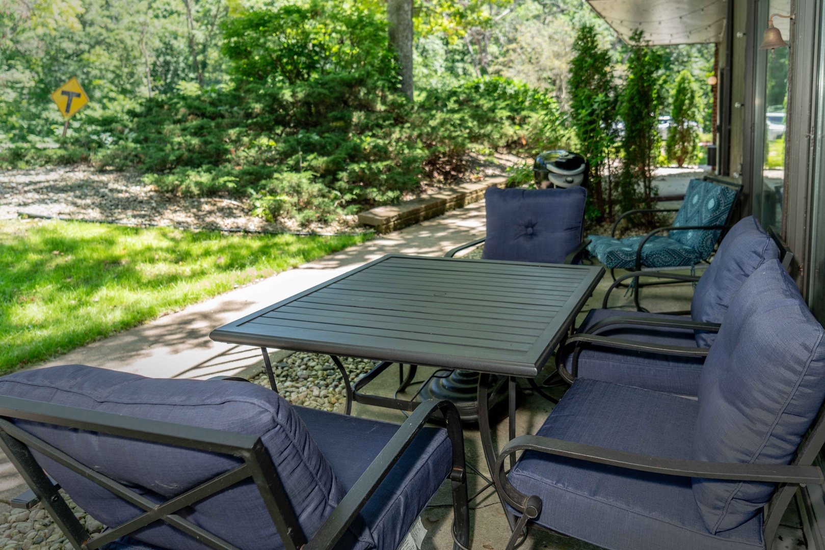 Patio with outdoor seating and grill