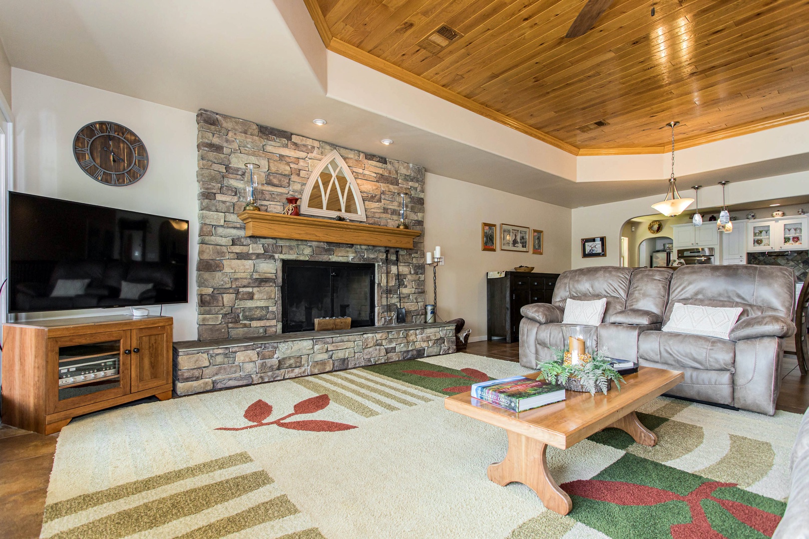 Living room with cable TV, fireplace, and comfortable seating
