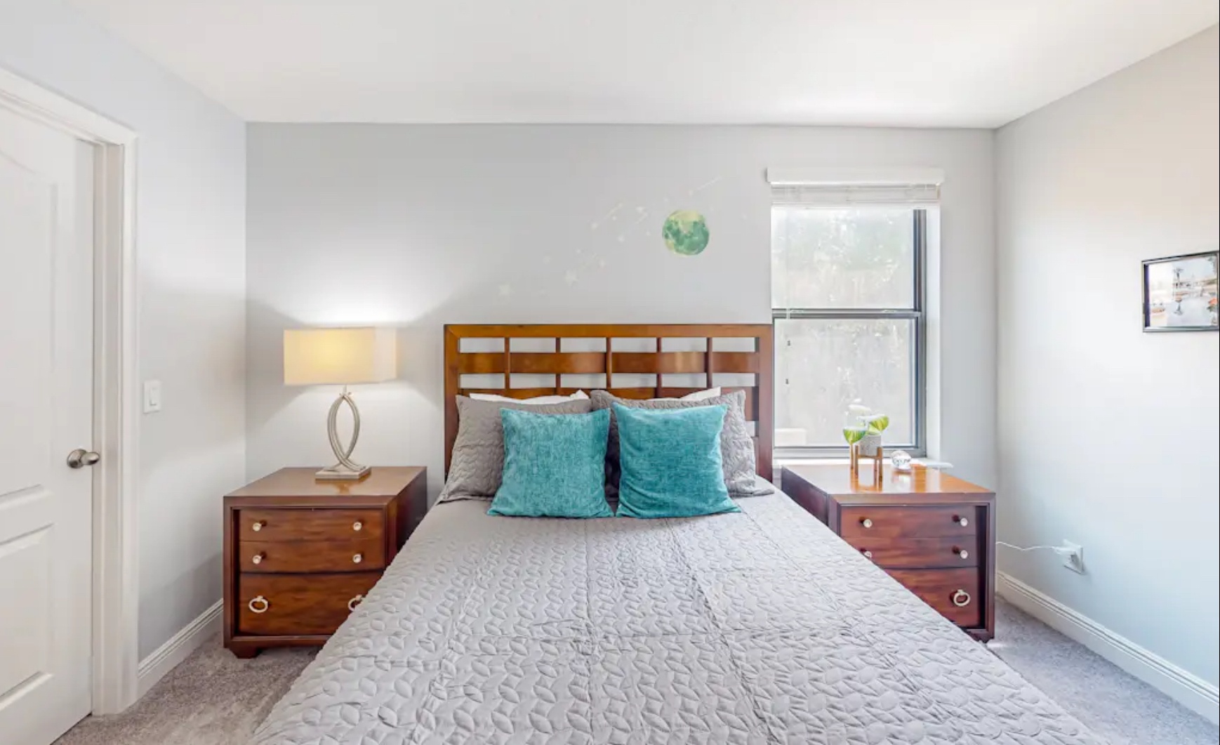 The last bedroom retreat showcases a chic queen bed & TV