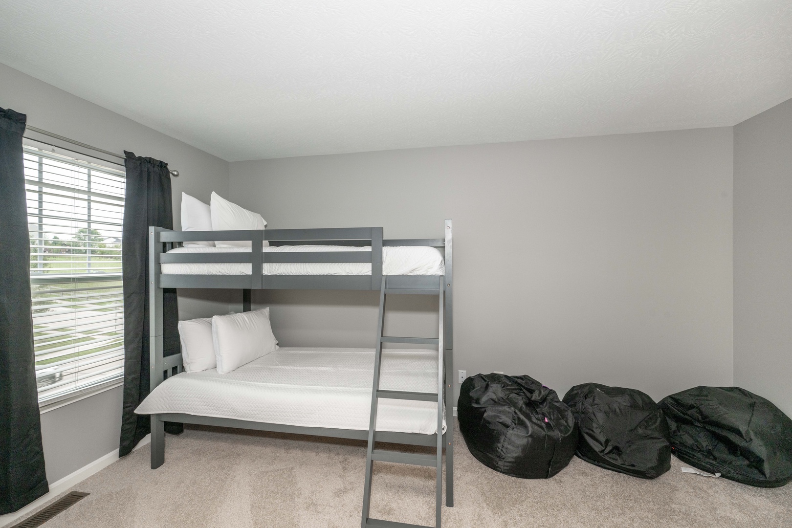 The third bedroom features a cozy twin-over-twin bunkbed