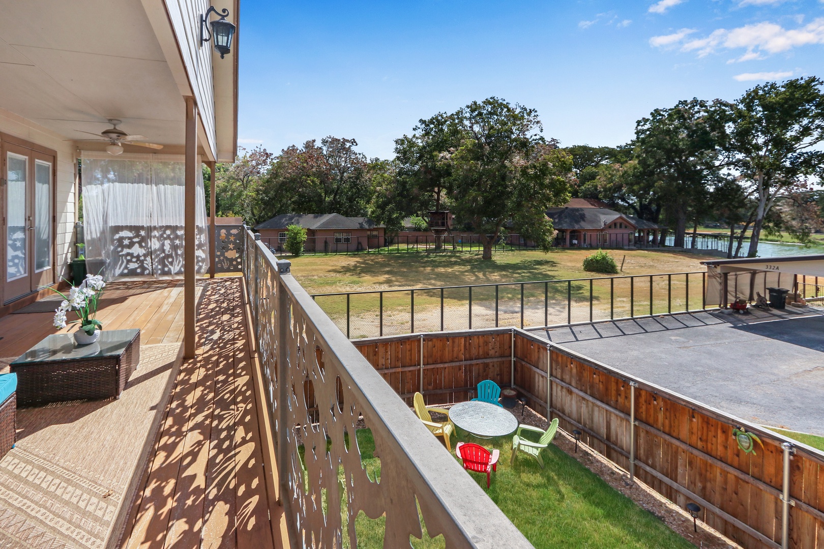 The 2nd level back deck overlooks the spacious fenced back yard