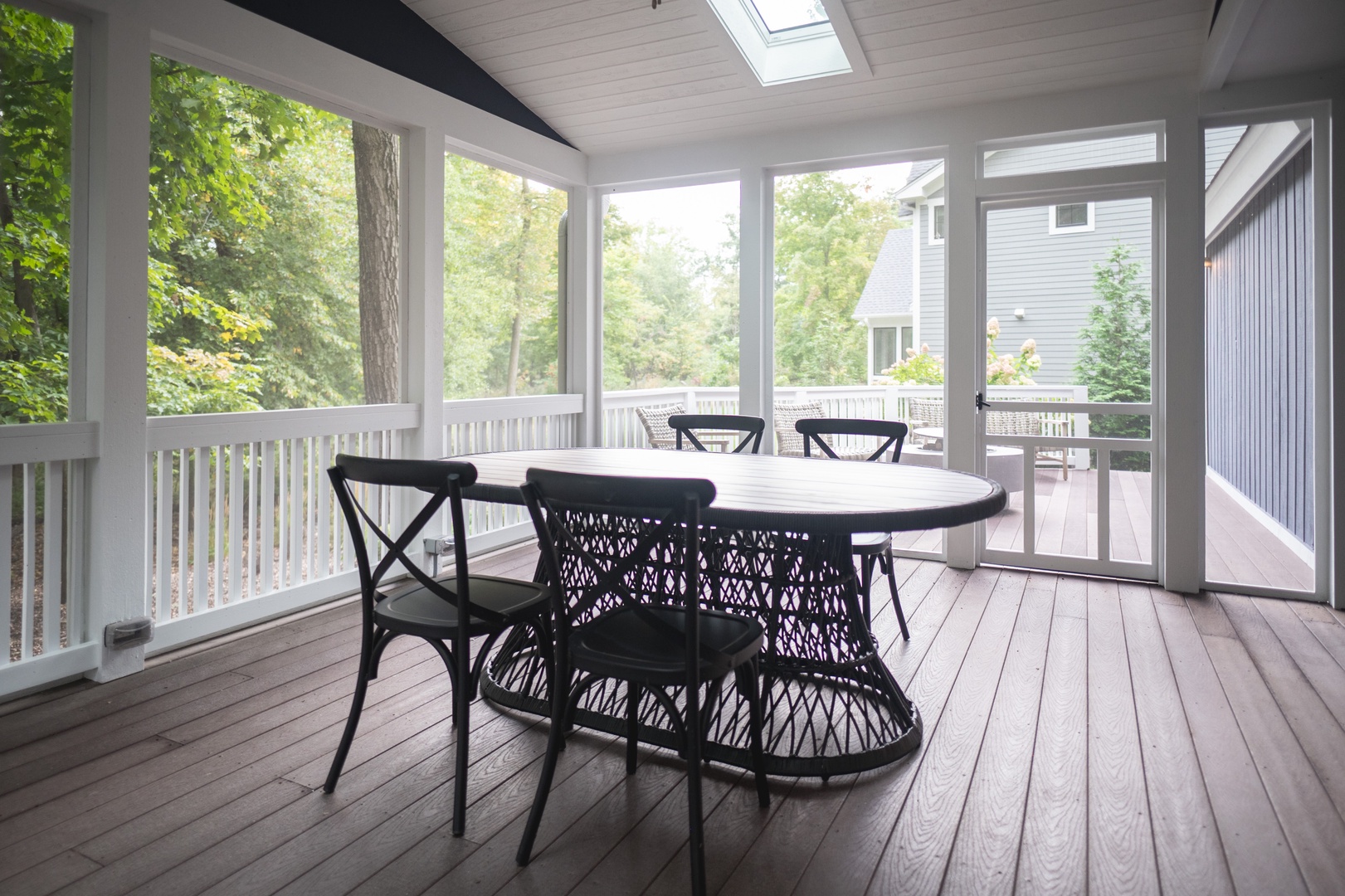 Enjoy a meal on the screened-in porch