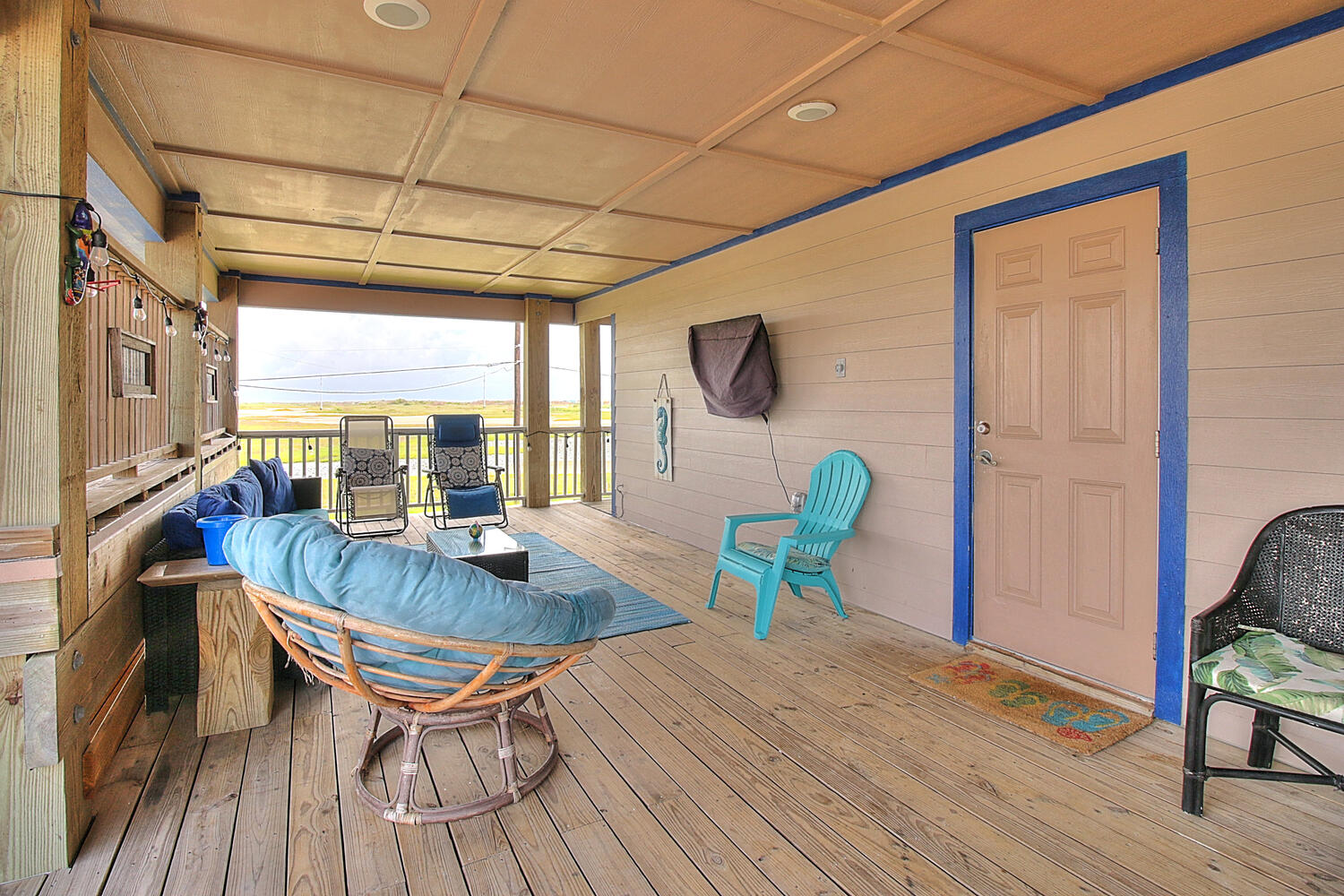 Covered deck with outdoor seating, and TV
