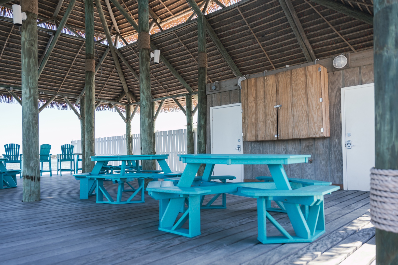 Enjoy scenic bay views and a meal with your group at the picnic tables in the tiki hut