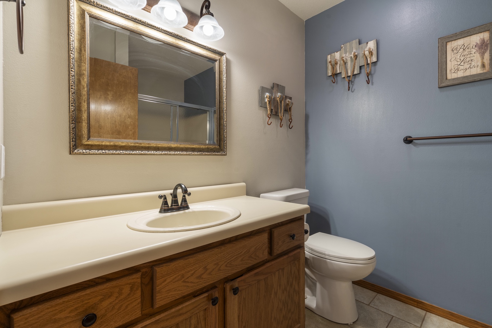 The shared full bath features a single vanity & shower