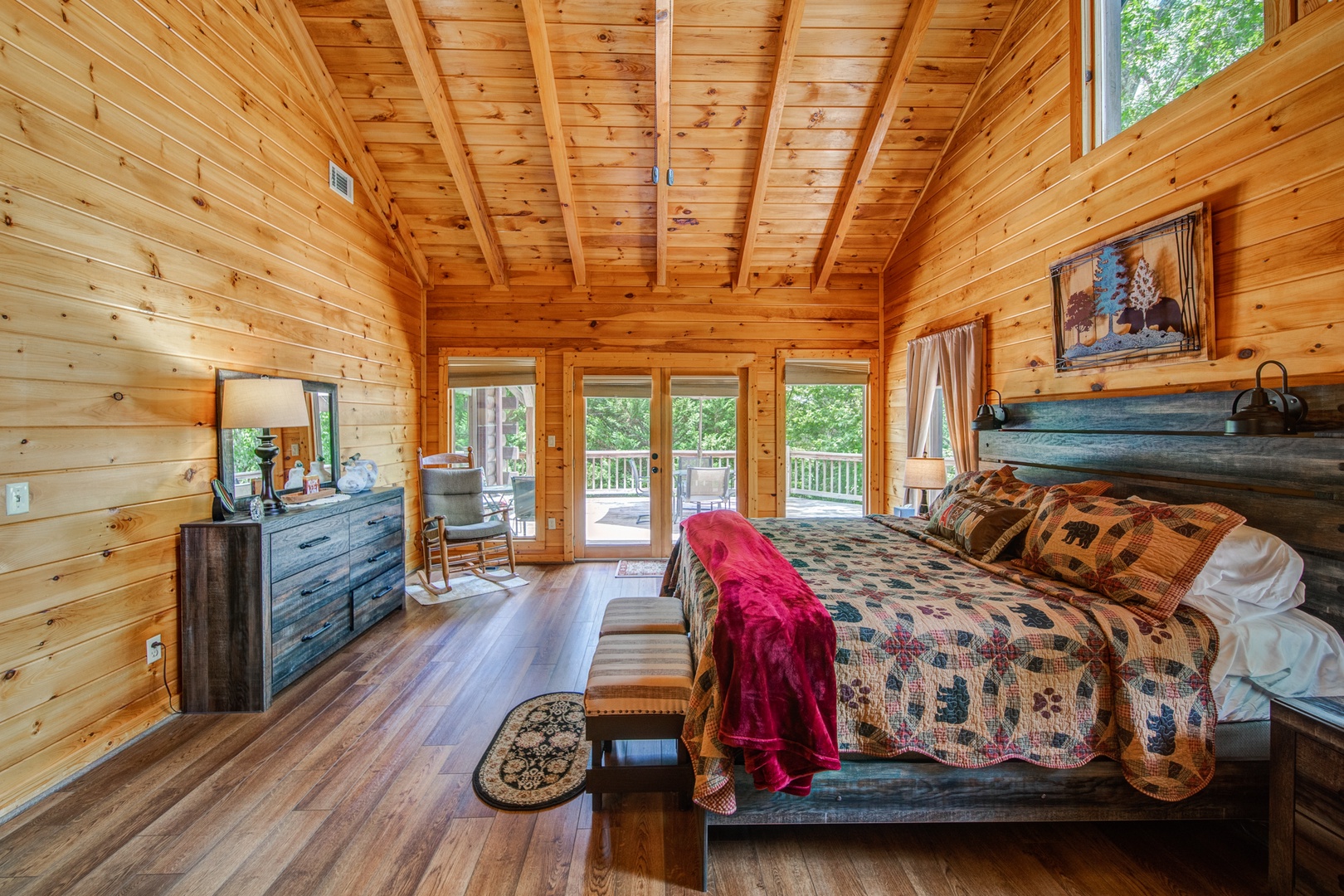 The upper-level king master bedroom offers grand views & a private en suite