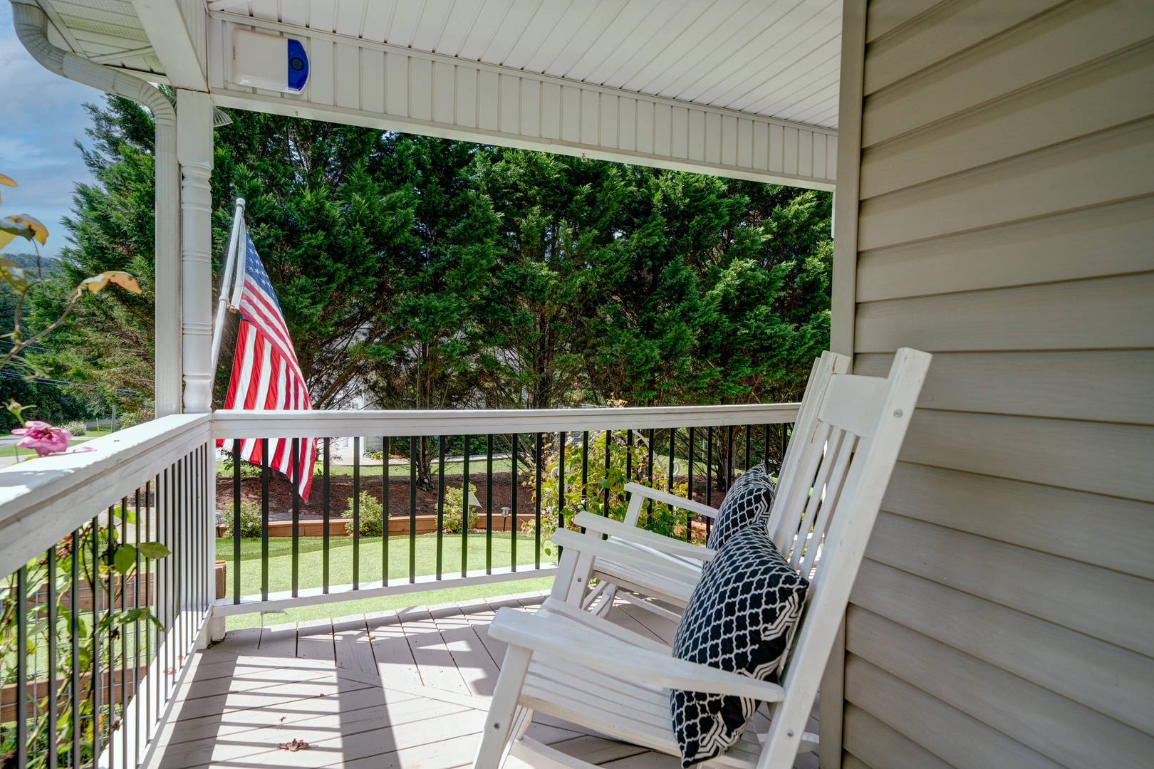 Front porch Rocking chairs to take in the view of the Putting green