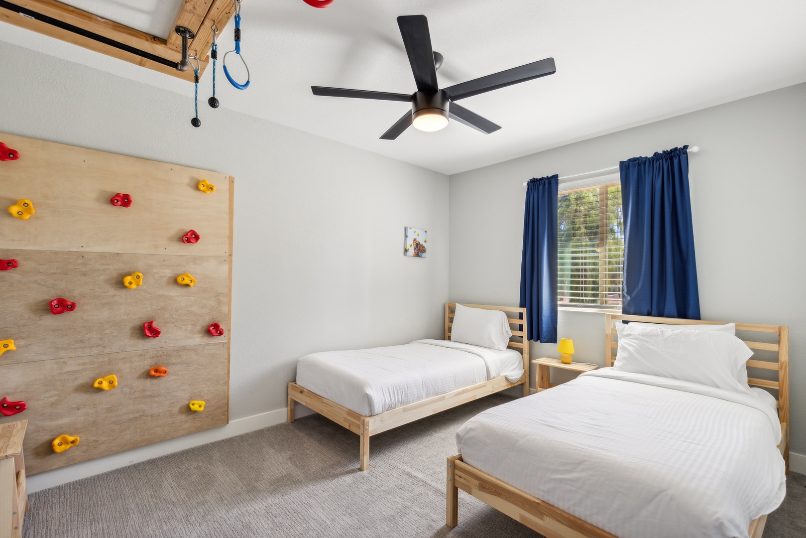 Bedroom 5 with 2 twin beds, and rock wall