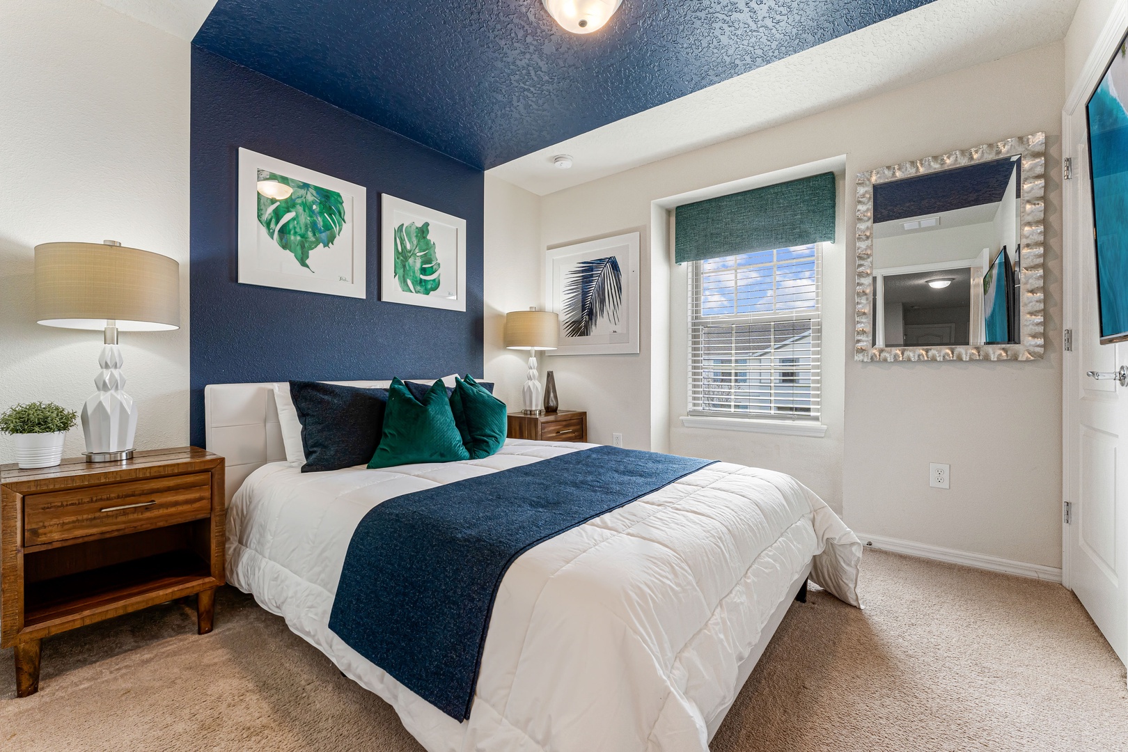 This cozy bedroom retreat features a comfortable queen-size bed & smart TV