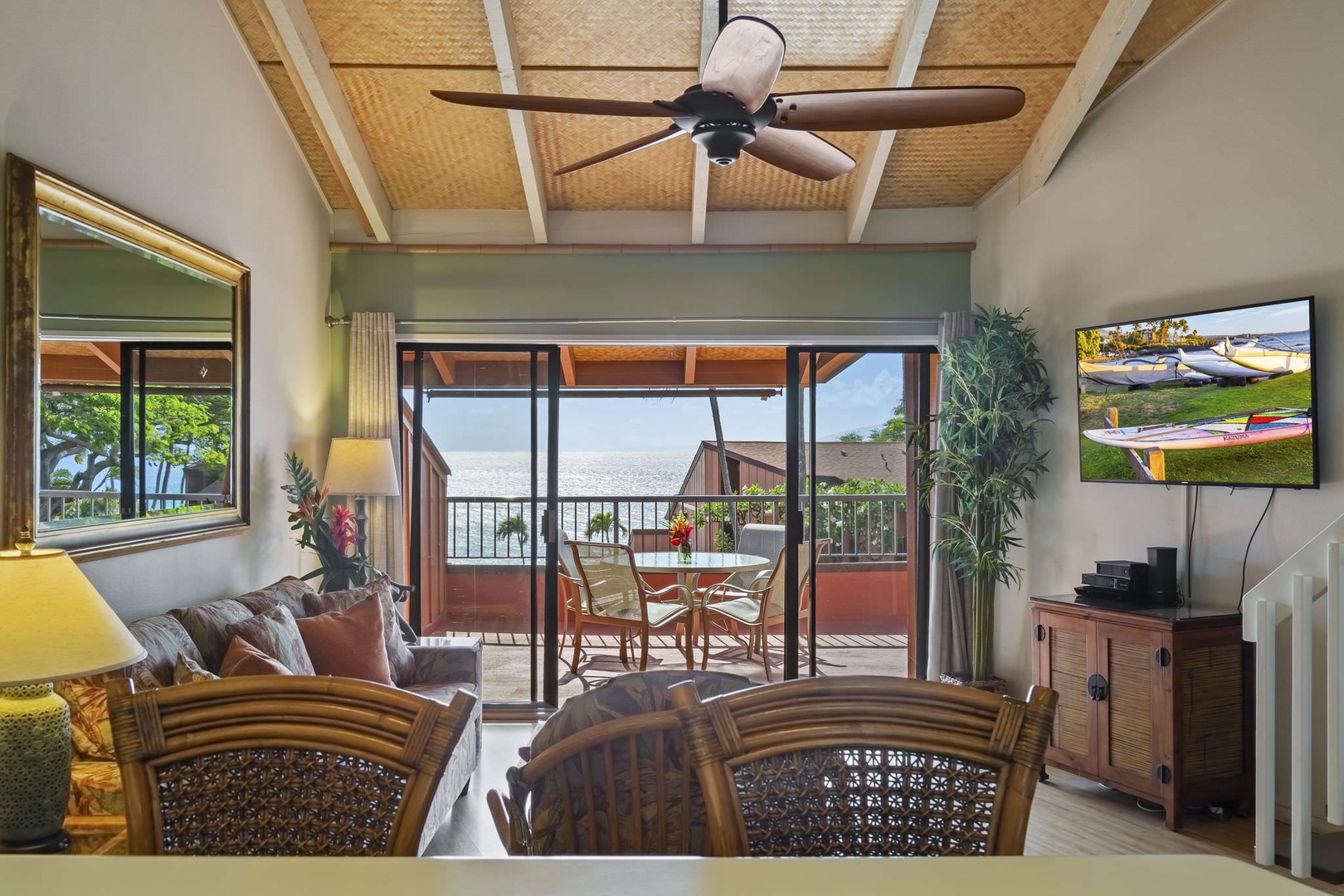 Floor-to-ceiling sliding glass doors in the living area