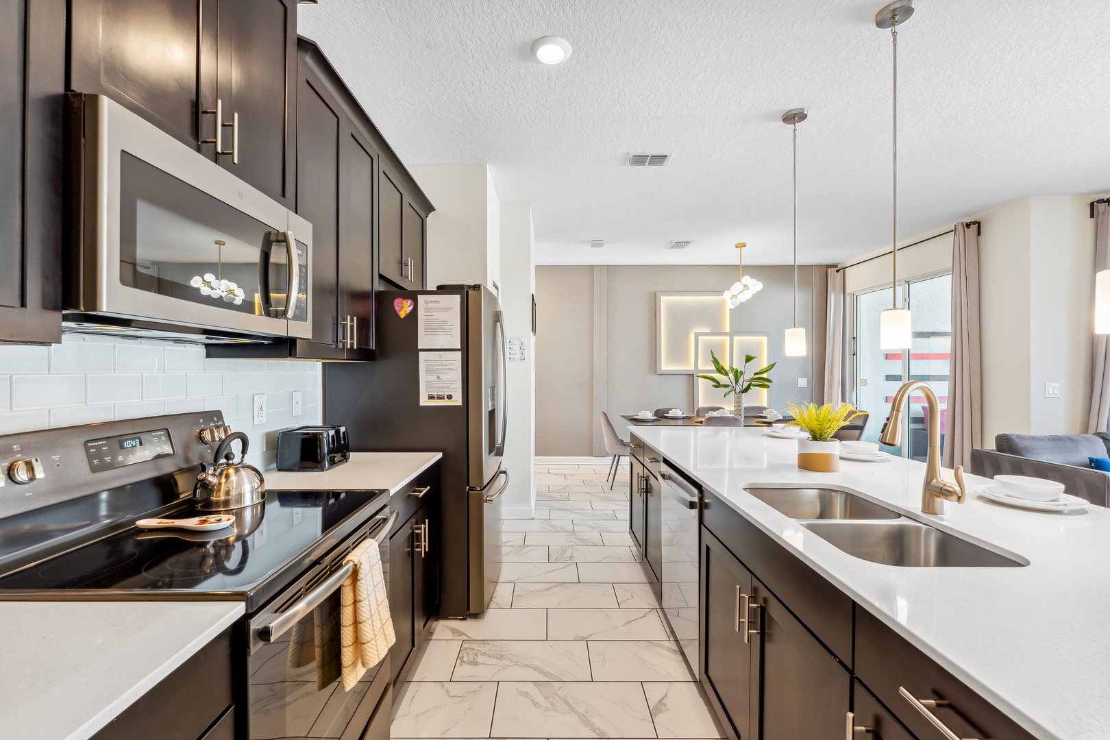 The open, airy kitchen offers ample space & all the comforts of home