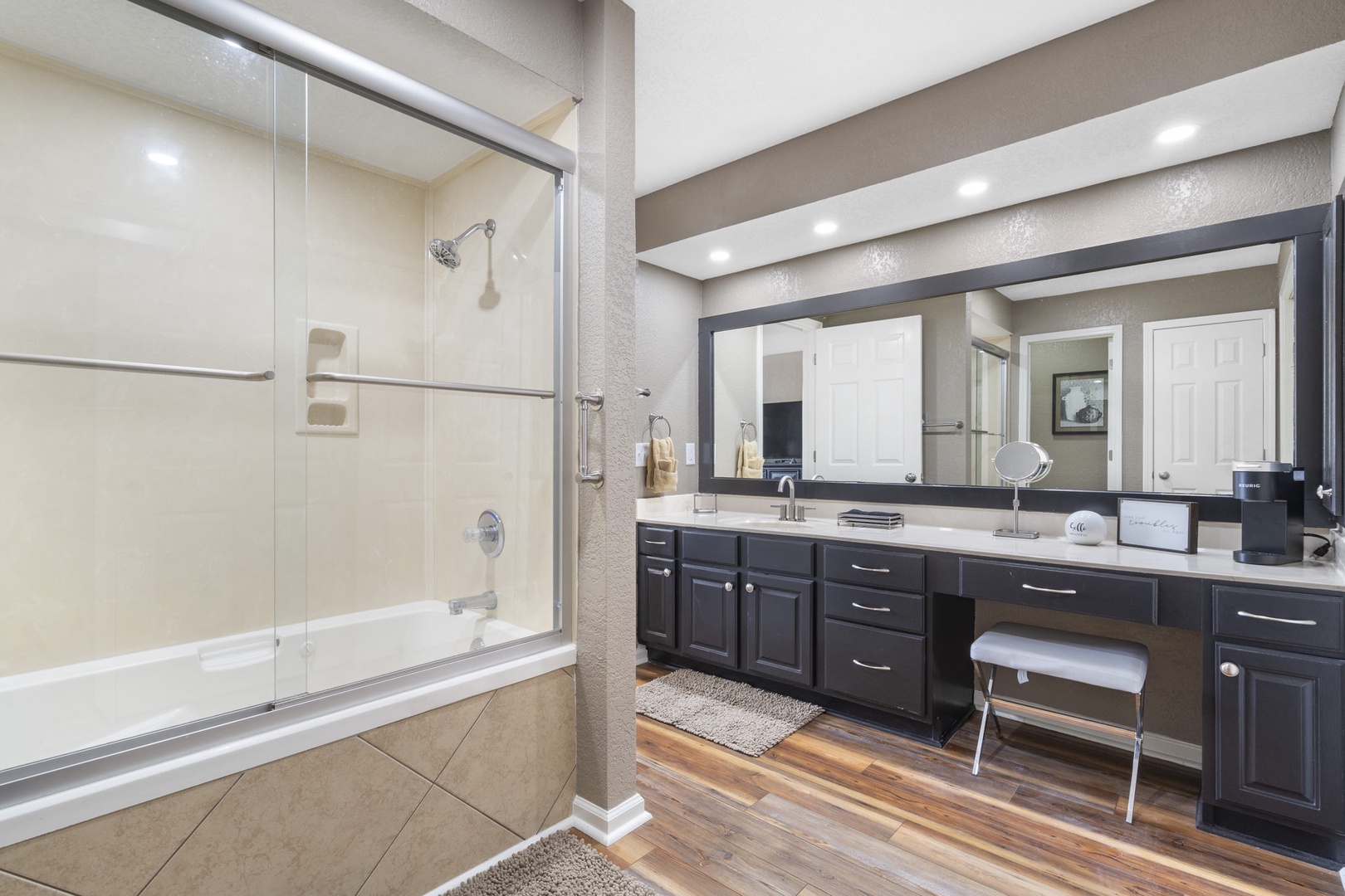 Bathroom 1 with dual sinks, shower/tub combo