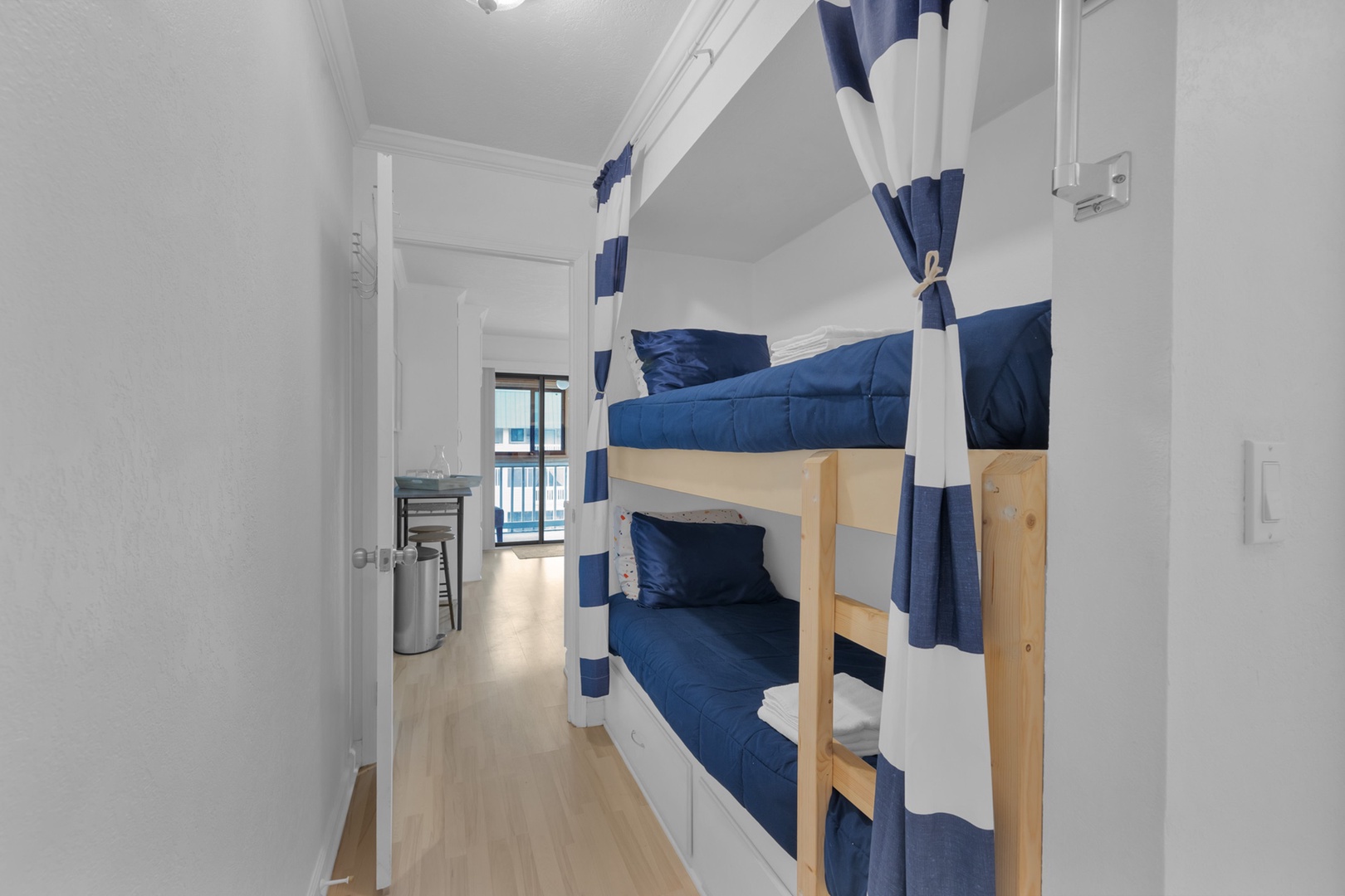The cozy sleeping nook showcases twin-over-twin bunkbeds