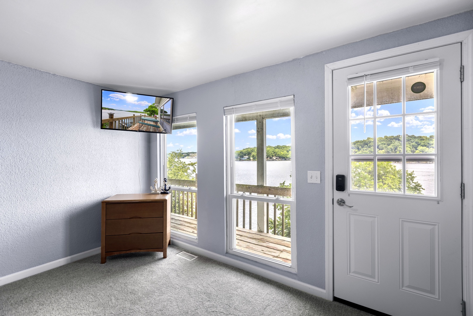 A queen bed & Smart TV is available in this lower-level bedroom