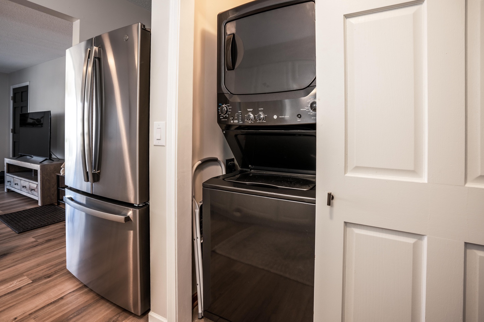 Private laundry is available for your stay, tucked away in the kitchen