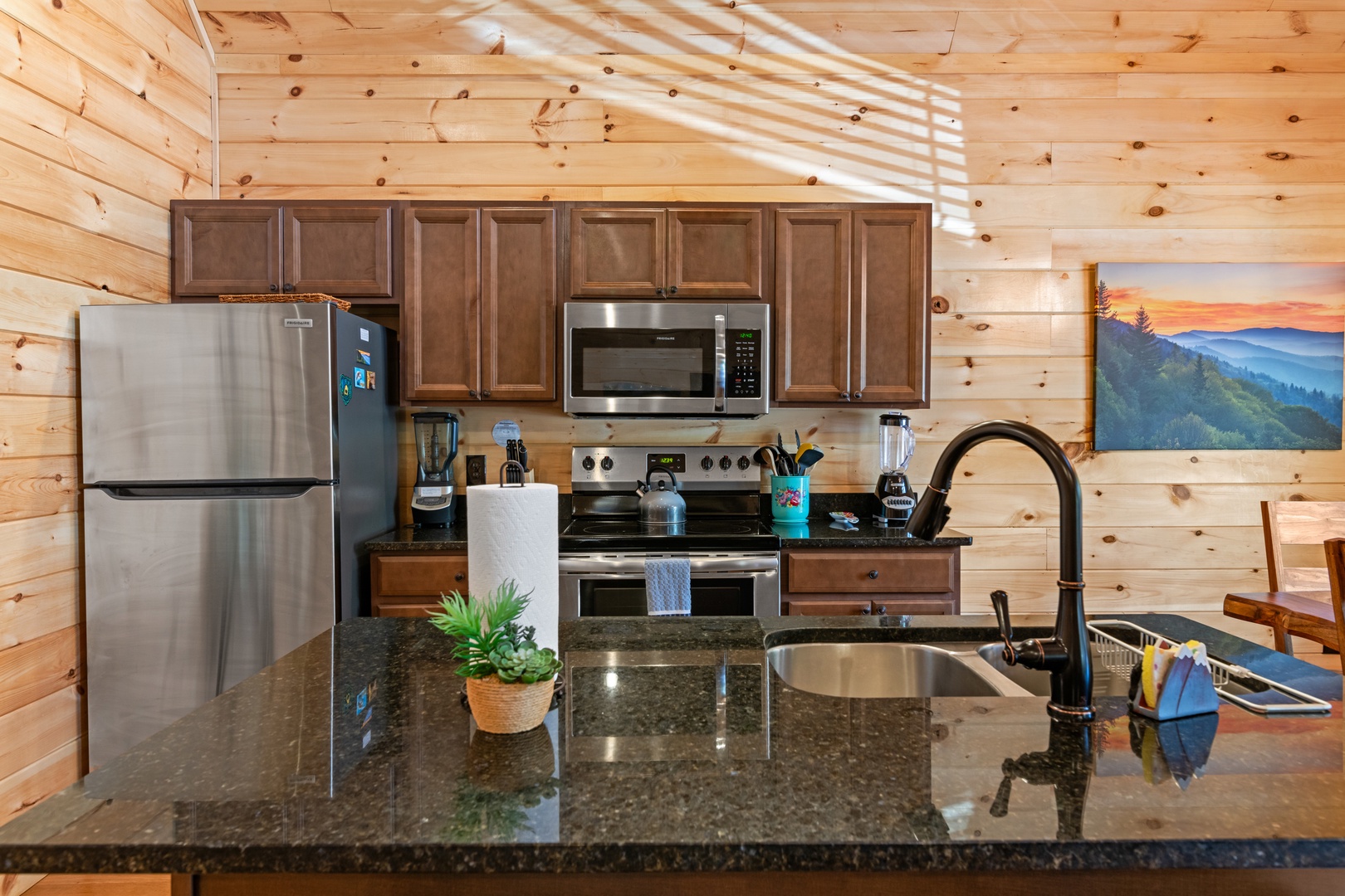 The open, airy kitchen offers ample space & every home comfort