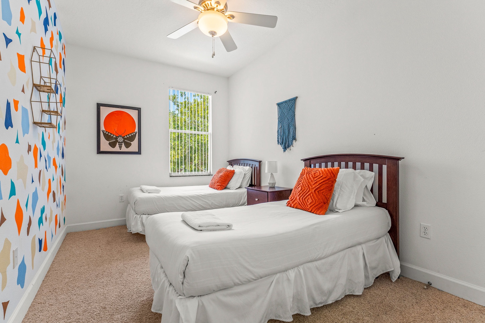 Cheerful double twin bedroom with vibrant, colorful walls