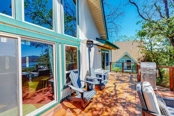 Stay warm under the heater while enjoying breathtaking lake views from the Back Deck