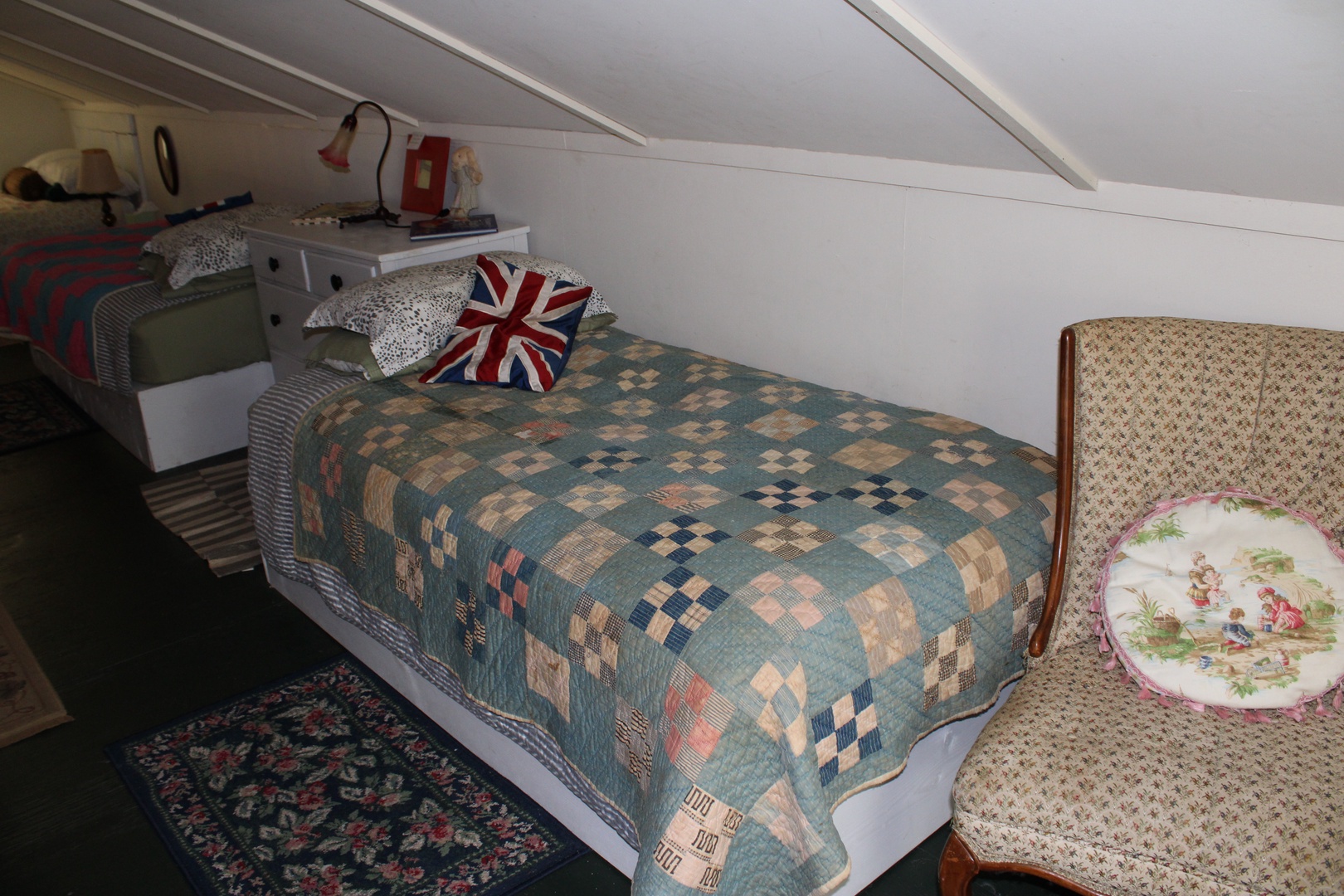 The serene loft bedroom includes three beds (one full & two twins)